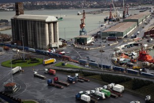 Departure of train loaded with containers