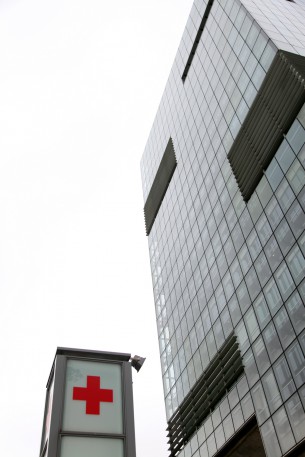 Port of Bilbao building and medical service signpost